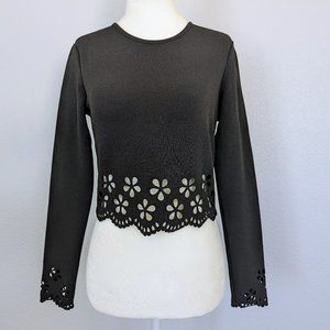 Long sleeved crop top with petal cut outs